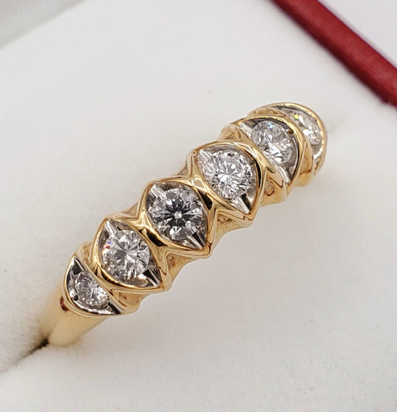 10kt yellow and white gold ring with seven v-prong set round brilliant cut diamonds 0.50ct
